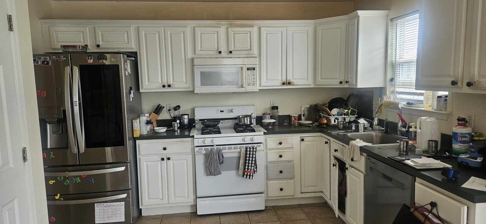 Before: dated raised-panel kitchen